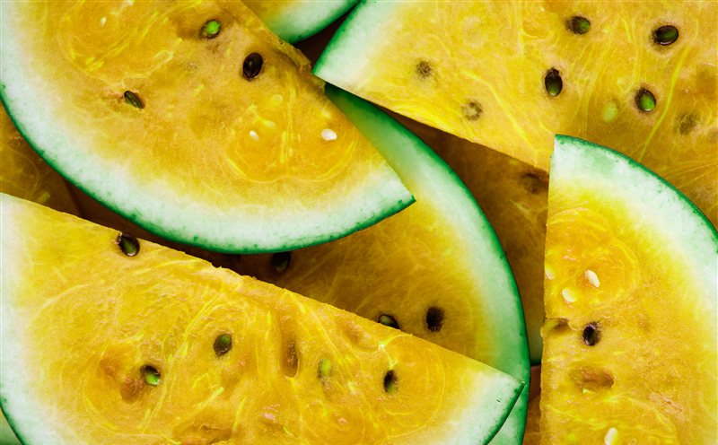 Bright yellow watermelon wedges with green rinds